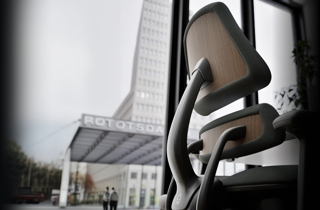 Anthros precision posture chair, viewed from behind in a modern office setting